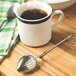 A Fox Run stainless steel tea strainer in a cup of tea.