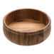 An Ironwood acacia wood salad bowl with beadrim on a table.