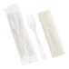 A World Centric compostable plastic fork wrapped in a napkin.