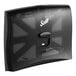 A black plastic Scott toilet seat cover dispenser with a clear cover.