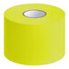 A roll of chartreuse paper labels.