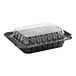 A black Pactiv MealMaster chicken barn with a clear lid.