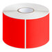 A roll of red rectangular inventory labels with white circles on a white background.