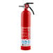 A close up of a red First Alert fire extinguisher with a white label.