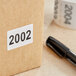 A white rectangular Lavex paper label roll with black consecutive numbers.
