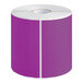 A roll of purple paper labels.