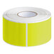 A roll of chartreuse rectangular Lavex labels with white stripes on a white background.