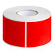 A roll of red rectangular Lavex inventory labels with white text on a white background.