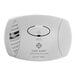 A white First Alert plug-in carbon monoxide alarm with a round button.