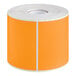 A roll of Lavex orange rectangular inventory labels with white backing.