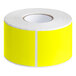 A roll of bright yellow rectangular Lavex labels.