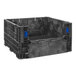 A black plastic container with blue handles.