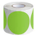 A roll of Lavex fluorescent green round inventory labels with white polka dots.