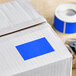 A roll of light blue rectangular Lavex inventory labels.