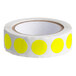 A roll of Lavex bright yellow round paper labels with white backing.