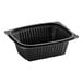 A Pactiv black plastic deli container with a lid.