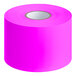 A roll of pink rectangular paper labels.