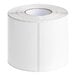 A roll of white rectangular paper labels.