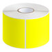 A roll of bright yellow rectangular labels with white edges.