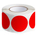 A roll of red semi-gloss paper labels with red circles.