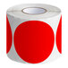 A roll of red semi-gloss paper inventory labels with white polka dots.