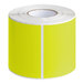 A roll of chartreuse Lavex rectangular inventory labels with white stripes.