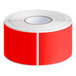 A roll of Lavex fluorescent red rectangular inventory labels with white stripes.