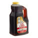 A jug of Log Cabin Original Breakfast Syrup with a brown label.