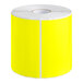 A roll of bright yellow rectangular Lavex inventory labels.