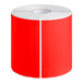 A roll of red rectangular Lavex inventory labels with white paper on the back.