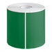 A roll of green rectangular labels with white trim.