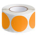 A roll of Lavex orange paper inventory labels with white circles and orange dots.