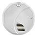 A white First Alarm smoke detector with a round lid.