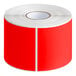 A roll of Lavex rectangular fluorescent red inventory labels with white stripes on the edges.