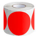 A roll of red semi-gloss paper Lavex inventory labels with white text.