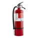 A close up of a red First Alert heavy-duty commercial fire extinguisher.