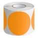 A roll of Lavex fluorescent orange and white round inventory labels.