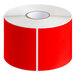 A roll of white labels with red borders.