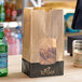 A Bagcraft EcoCraft printed meal bag with chicken and soda inside.