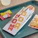 A tray with a hot dog in a Bagcraft printed foil bag and some chips.