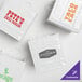 A group of white Innopak shopping bags with green logos.