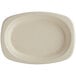 A white oval World Centric compostable fiber plate.