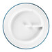 A white porcelain plate with blue trim around the edge.