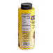 A yellow Lyons Designer Dessert Mango Flavoring Sauce bottle with a black cap and label.