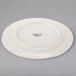 A white Libbey porcelain plate with a medium rim.