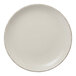 A white Libbey Farmhouse Coupe porcelain plate with brown speckled border.