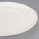 A white Libbey round porcelain plate with a wide brown rim.