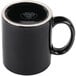 A black porcelain Libbey mug with a white rim.