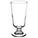 A Libbey footed highball glass with a clear glass and a small base.