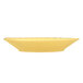 A Libbey round porcelain bowl in butter yellow.